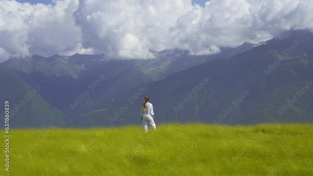 Woman in the wind between green nature Woman in the wind between green nature