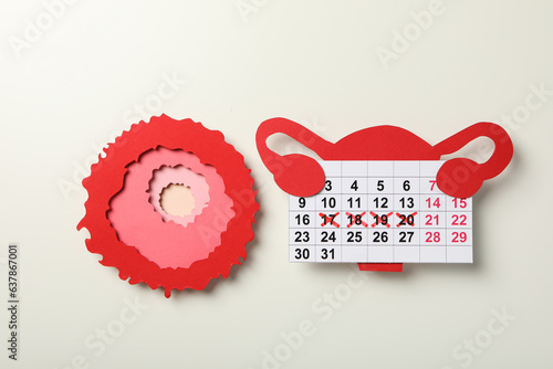 Ovulation period, calendar with clock, conception process. photo
