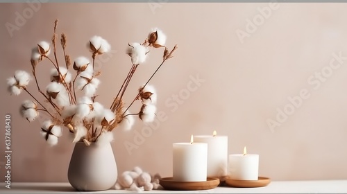 Stylish table with cotton flowers and aroma candles near light wall, Home decor, Banner for design.