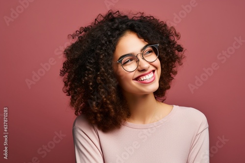 smiling happy laughing female wearing glasses with plain neutral background