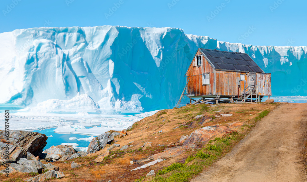 Red house in settlement of Tiniteqilaaq on Sermilik Fjord, East Greenland