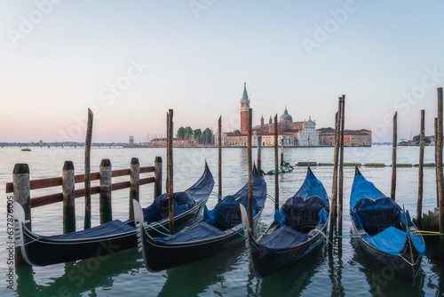 Sunrise in San Marco square, with gondolas on the Venice Grand Canal, Venice, Italy