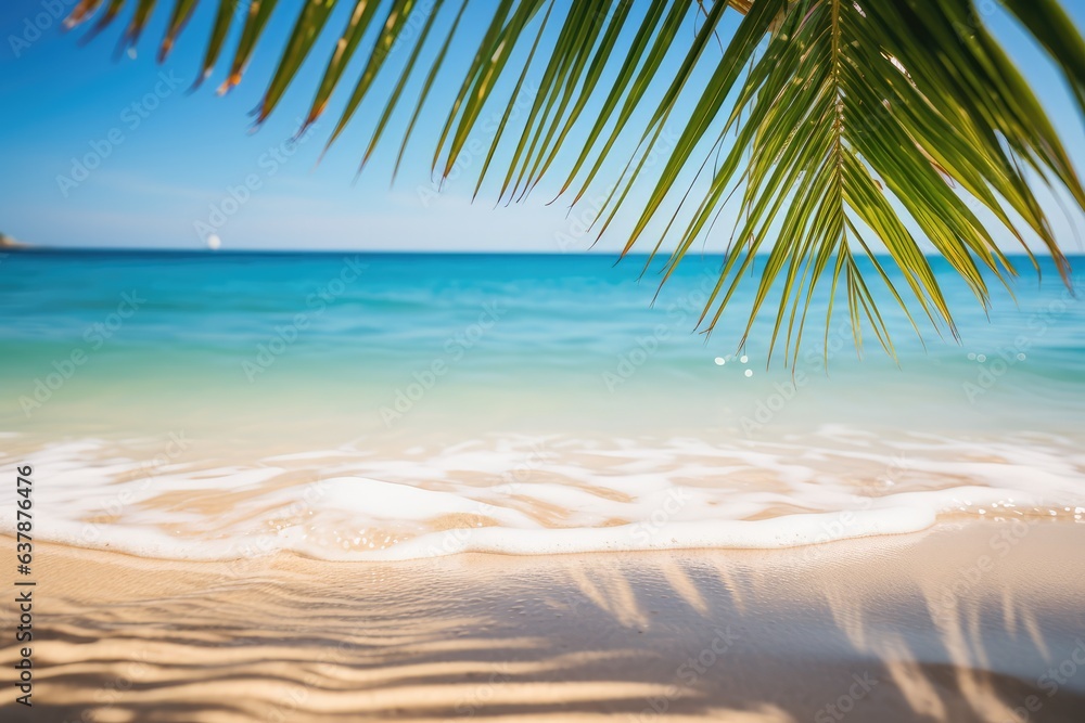 idyllic tropical sand beach scene with blue water wave and palm leaf