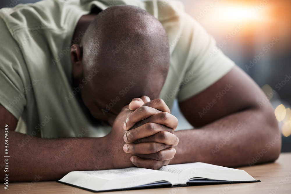 Bible, hands and praying man with book and religion study at home for worship and spiritual support. Faith, christian knowledge and person with gratitude, scripture education and guidance in a house Bible, hands and praying man with book and religion study at home for worship and spiritual support. Faith, christian knowledge and person with gratitude, scripture education and guidance in a house