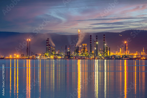 Tüpraş oil refinery factory by the sea. Panoramic view of oil refinery plant in sunny day. Kocaeli, Turkey photo