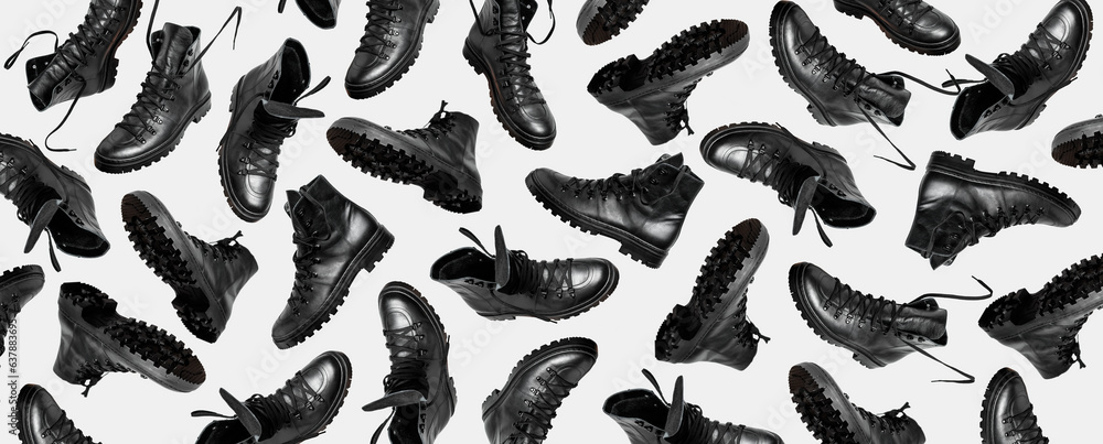 Shoe pattern. Black leather men's boots with lace isolated on gray background. Military hiking boots, autumn winter unisex footwear. Minimalistic footwear Mock up. Cut out objects for design Shoe pattern. Black leather men's boots with lace isolated on gray background. Military hiking boots, autumn winter unisex footwear. Minimalistic footwear Mock up. Cut out objects for design