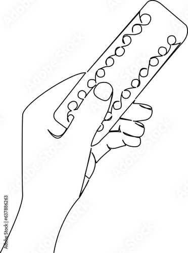 hand with birth control pills