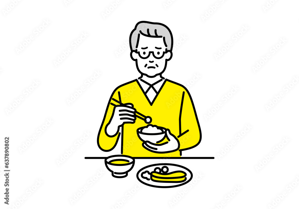 一人で食事する孤独なシニアの男性