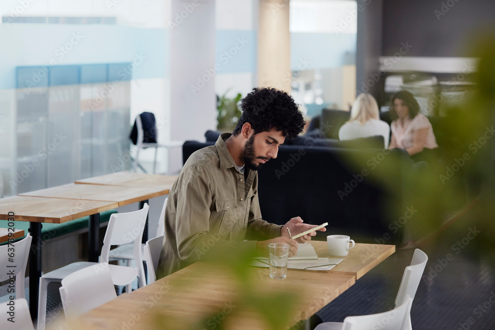 Man working solitary in office cafeteria Man working solitary in office cafeteria