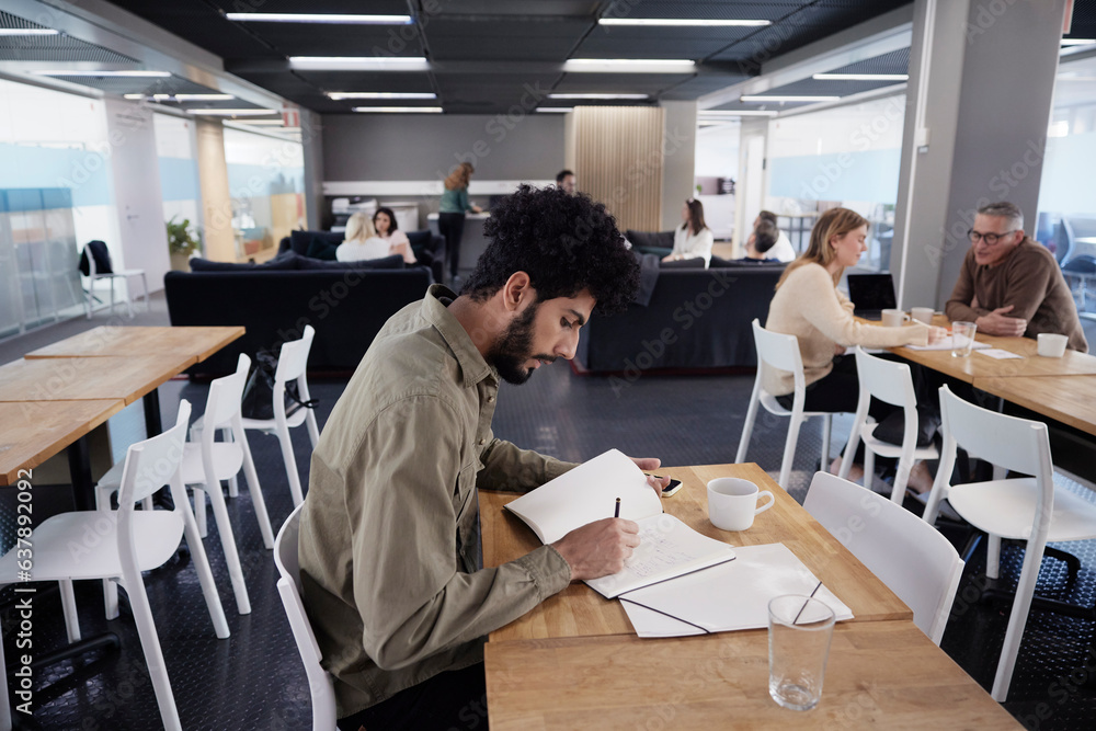 Man working solitary in office cafeteria Man working solitary in office cafeteria