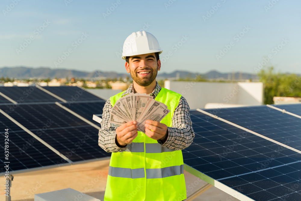 Excited engineer worker with a lot of money working with clean energy Excited engineer worker with a lot of money working with clean energy