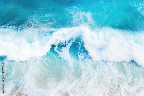 a beautiful blue ocean with crashing waves from an aerial perspective