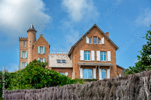 Country house on red rocks at picturesque Ile de Brehat island in Brittany, in France