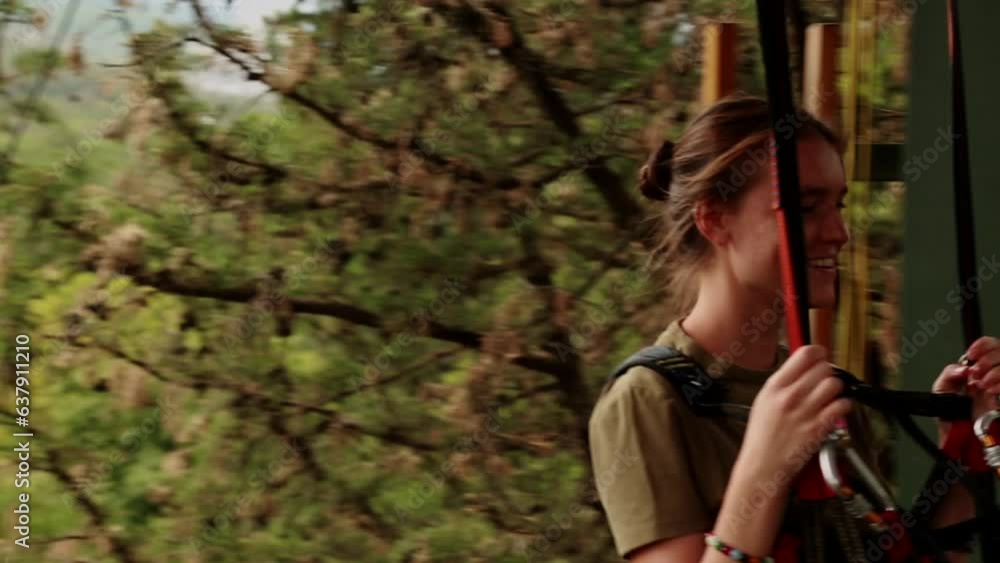 A young girl descended on a zip line to the lower base overwhelmed with emotions