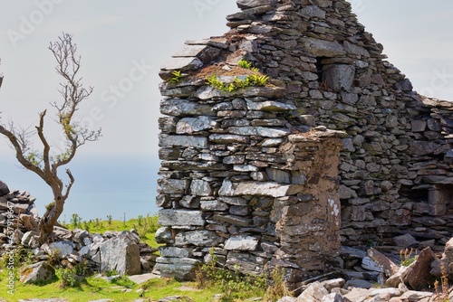 Fragment of the ruins of an old stone house in Barmouth, UK photo