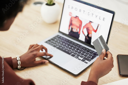 Woman  hands and laptop with credit card in online shopping  payment or banking on fashion at office. Closeup of female person with debit on computer in ecommerce  buying or fintech at the workplace