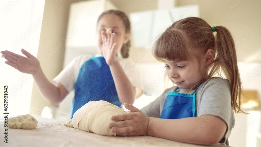 kids are baking. children knead dough and flour in the kitchen. happy family dream kid concept. baby children bake pizza dough. sisters baking cookies. teamwork children knead dough and flour kids are baking. children knead dough and flour in the kitchen. happy family dream kid concept. baby children bake pizza dough. sisters baking cookies. teamwork children knead dough and flour