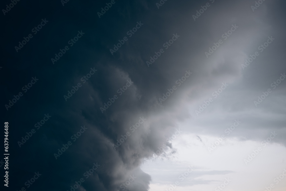 a dark storm cloud is approaching the city a dark storm cloud is approaching the city