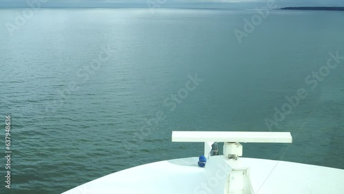 Point of view from the main deck of the cruise ship to the sea and the blue sky.