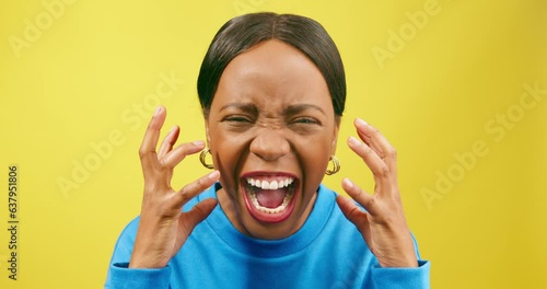 Angry woman screams and yells with hand gestures, yellow studio