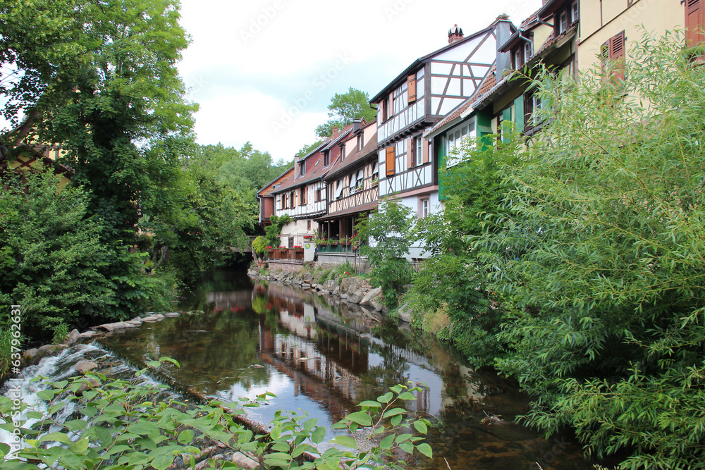river weiss and houses in kaysersberg in alsace in france