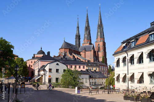 City life in the center of Uppsala, Sweden with a view of Cathedral on backrgound photo