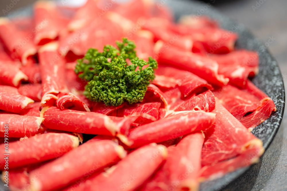 Slice of the fresh raw beef for shabu shabu