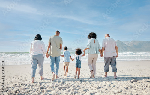 Family, holding hands and relax outdoor on a beach with love, care and happiness for summer vacation. Behind, space in sky or travel with men, women and children together at sea for holiday adventure