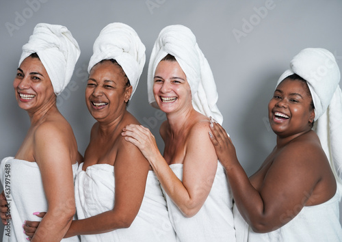 Multiracial women with different ages having fun together during skin care spa day