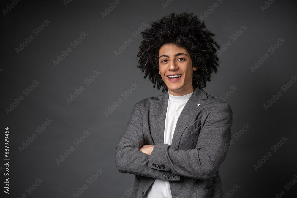 Young man in grey jacket standing with a confident look Young man in grey jacket standing with a confident look