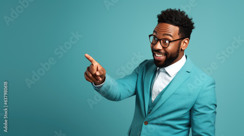 Middle aged man wearing suit pointing with hand and finger to the side looking at the camera. photo