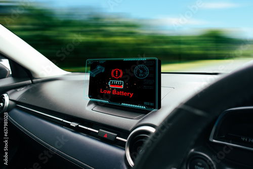 Low battery caution display on screen of a car malfunction, The battery voltage signal is dropping and low on car multimedia screen of EV electric vehicle car, EV electric vehicle technology concept.