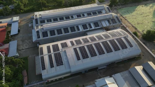 solar energyAerial view of a solar panel on building roof top. Part of reduce reuse and restore. Renewable energy concept photo
