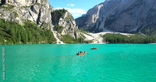 Lake Braies (or Lago di Braies) famous lake in Dolomites Alps Italy Europe extra wide panorama aerial fly forward, dolly footage in HDR photo