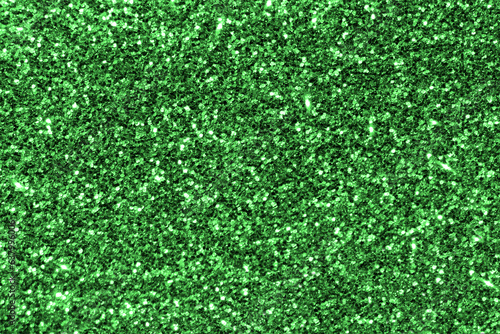 Green glitter texture background.  Photo can be used for the concept of New Year, Christmas and all celebration background concepts. 