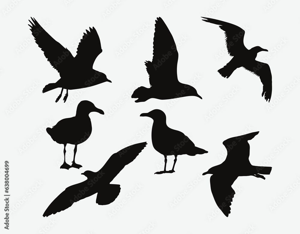 Obraz premium Graceful Seagull Silhouettes Set, Majestic Coastal Birds in Diverse Flying Poses and Resting Stances for Art and Design Projects