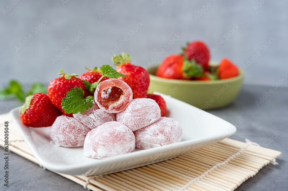 Strawberry mochi on a plate, rice asian sweets. Strawberry mochi on a plate, rice asian sweets.