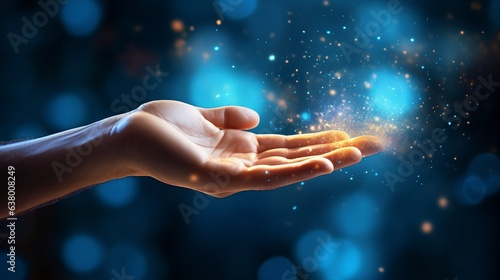 Illustration of a opened hand and golden sparks fly out of it, blue background photo