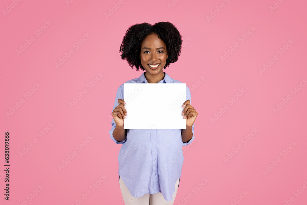 Positive young black pregnant lady in casual with big belly, enjoy motherhood, show banner with copy space Positive young black pregnant lady in casual with big belly, enjoy motherhood, show banner with copy space