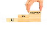AI act regulation symbol. Concept words AI artificial intelligence act regulation on wooden block. Beautiful white background. Businessman hand. Business AI act regulation concept Copy space