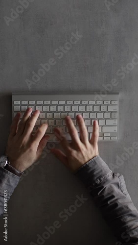 Businessman typing on a computer keyboard