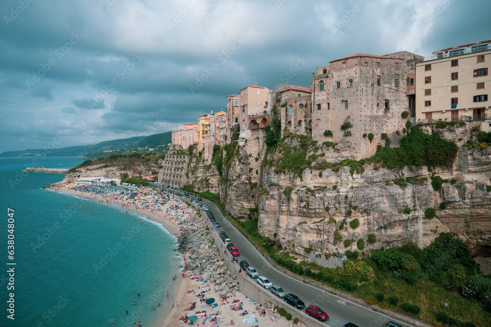 Italy, August 2023: panoramic view of the orgo of Tropea in Calabria. The town stands on a rock spur and overlooks a transparent Caribbean sea with many tourists