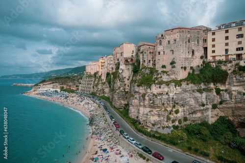 Fototapeta Naklejka Na Ścianę i Meble -  Italy, August 2023: panoramic view of the orgo of Tropea in Calabria. The town stands on a rock spur and overlooks a transparent Caribbean sea with many tourists