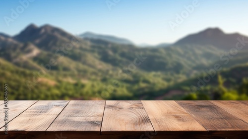 empty wooden table rustical style for product presentation with a blurred mountain landscape in the background