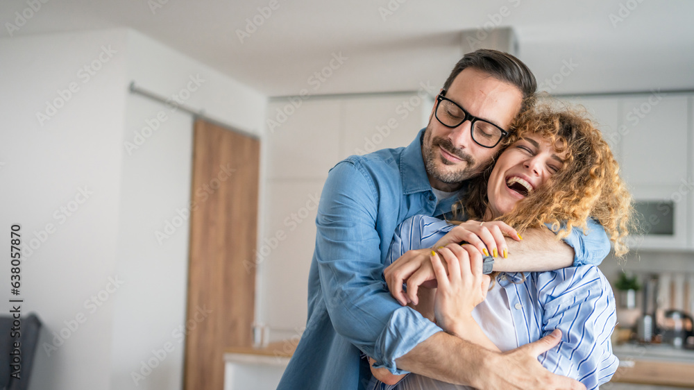 Happy adult caucasian couple at home husband and wife family concept Happy adult caucasian couple at home husband and wife family concept