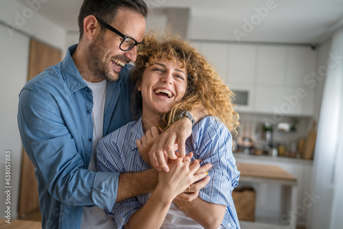 Happy adult caucasian couple at home husband and wife family concept