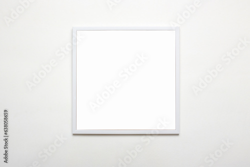 white picture frame on wall. Stylish modern photoframe for poster or picture