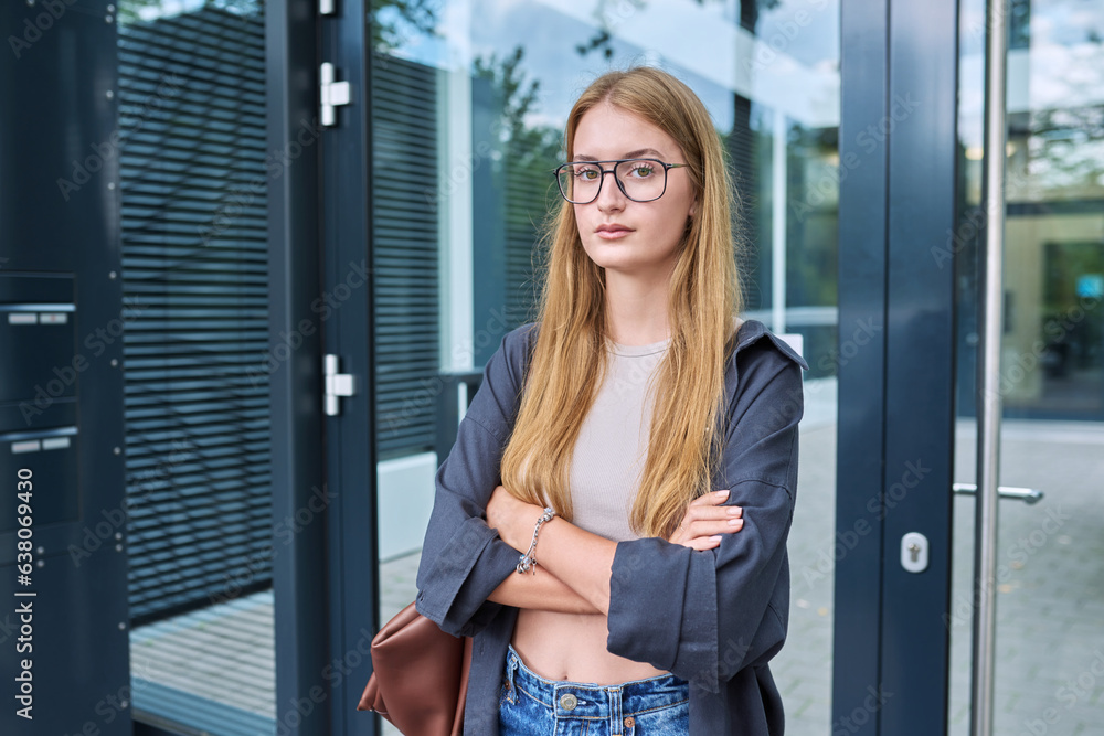 Portrait of young teenage student, trend girl in glasses looking at camera, outdoor Portrait of young teenage student, trend girl in glasses looking at camera, outdoor