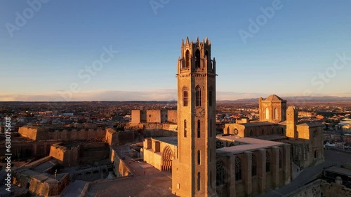 Panoramic aerial drone view of typical Gothic architecture La Seu Vella cathedral: vaults, colonnade, windows, arches of Cloister part Medieval Roman Catholic cathedral church de Santa Maria. 4K video