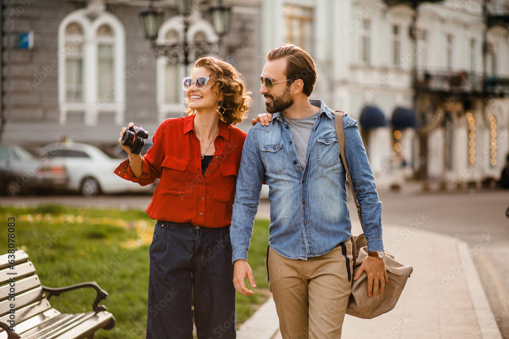man and woman on romantic vacation walking together